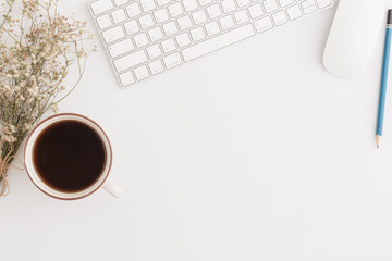 Wall Mural - flat lay photo of office desk with mouse and keyboard,copy space on white background with coffee and