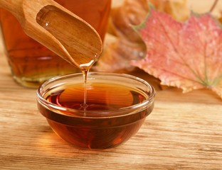 maple syrup on wooden background