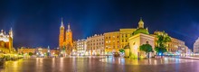 Night View Of The Rynek Glowny Main Square With The Church Of Saint Mary And Church Of Saint Adalbert In The Polish City Cracow/Krakow.