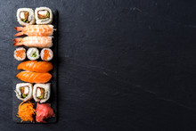 Overhead Shot Of Japanese Sushi On Black Concrete Background
