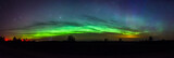 Fototapeta Tęcza - Green arc of aurora borealis in Estonia sky