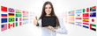 international language school concept smiling woman with like thumb up showing digital tablet on global flags background
