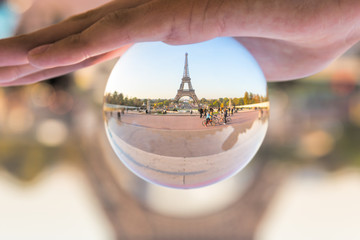 Fototapete - The Eiffel tower seen through a crystal ball, Paris France