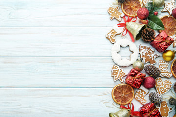 Wall Mural - Gingerbread cookies with chrismas decorations on wooden table