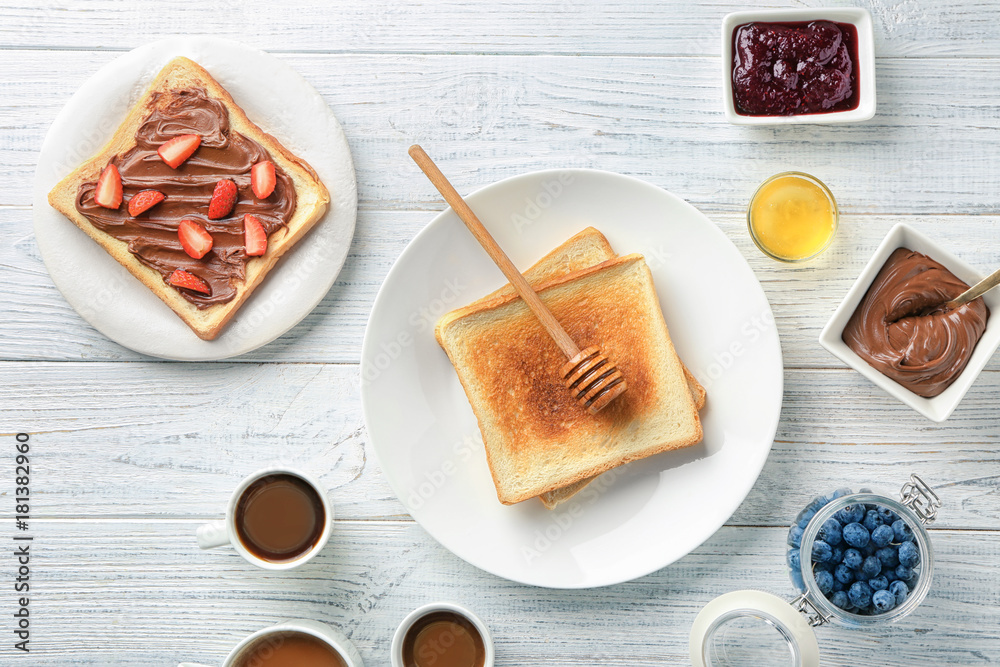 Composition with tasty sweet toasts on wooden table