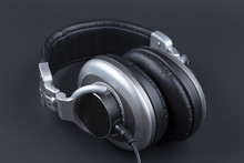 Professional Headphones With Wire On A Dark Background.