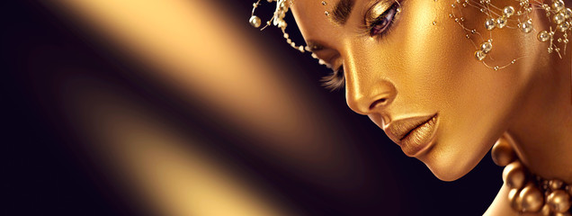 Wall Mural - beauty model girl with holiday golden shiny professional makeup