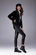 Sexy beautiful woman skinny body shape wear black bomber blouse lather pants shoes accessory hat luxury clothes glamour model beauty salon brunette hair fashion style party cosmetic makeup trend.