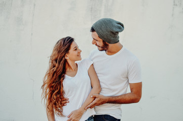 Young beautiful couple wearing blank t-shirt