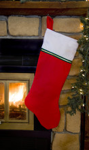Christmas Red Stocking Hanging On Fireplace