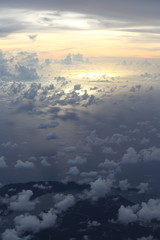 Wall Mural - Sunset White Cloud sky at high level attitude, view from window airplane