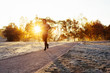 © baranq - Athletic man running during cold winter, autumn morning