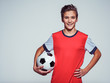 © Valua Vitaly - smiling teen boy in sportswear holding soccer ball