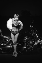 Young Woman In Lingerie Near Motorcycle..