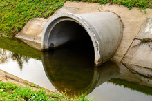 Concrete Culvert Pipe Hole System Draining Sewage Water. Environmental Disaster