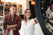 © Vadym Huzhva - A girl consultant shows the buyer in a bicycle store.