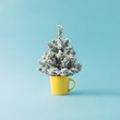 © Zamurovic Brothers - Coffee cup with Christmas tree. Minimal winter holidays concept.