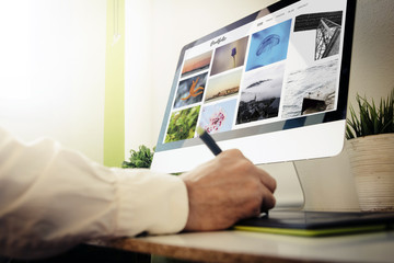 Poster - designer checking a portfolio website