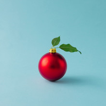 Apple Made Of Red Christmas Bauble And Leaves On Blue Background. Christmas Food Concept.