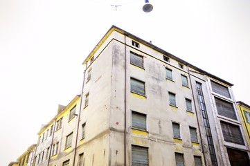 Vintage image of old and damaged  facade of uninhabited building. Years '60.