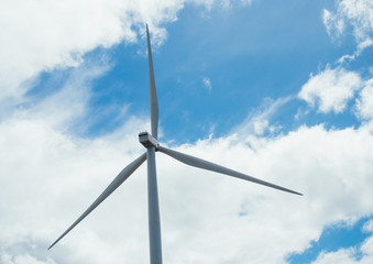 Wind turbines generating electricity with blue sky - energy conservation concept