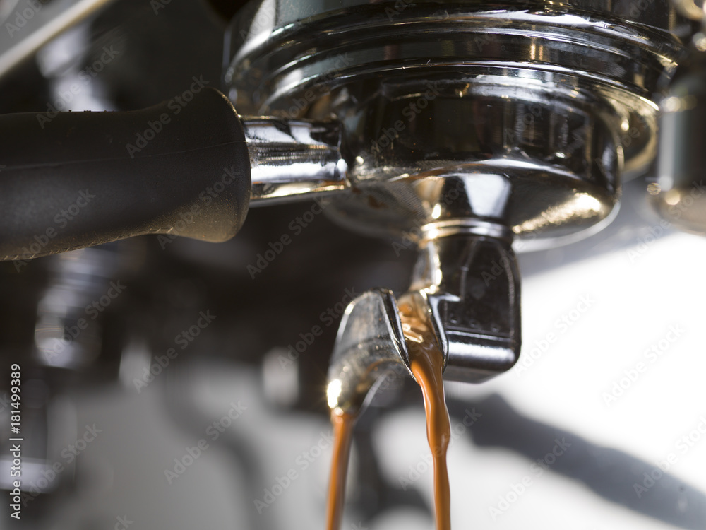 espresso extraction with a proffessional coffee machine, close up - obrazy, fototapety, plakaty 
