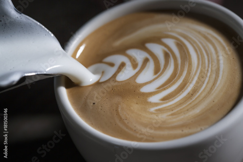 Making latte Art on a Cappucinno. Freshly made Tableau sur Toile