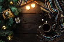 Coffee Grinder, Cup, Candles And Christmas Tree On A Wooden Table. Top View