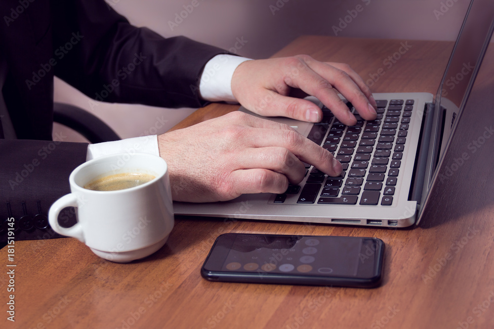 hands businessman on a laptop