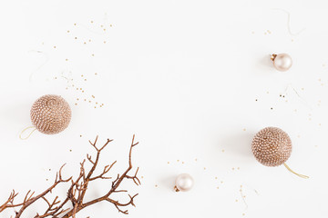 Christmas composition. Christmas balls, golden decorations on white background. Flat lay, top view, copy space