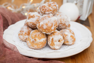 portuguese sweets cavacas on white plate on wooden background