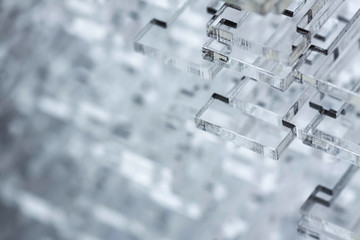 Abstract high-tech background. Details of transparent plastic or glass. Laser cutting of plexiglass.