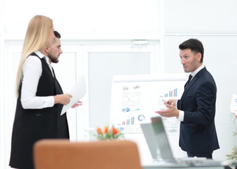  businessman makes a presentation to his business team