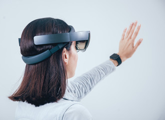 Woman wearing augmented reality goggles.