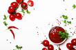 Tomato ketchup sauce with spices and herbs with cherry tomatoes in a bowl on white food background, top view