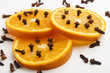 orange slices peppered with spice cloves