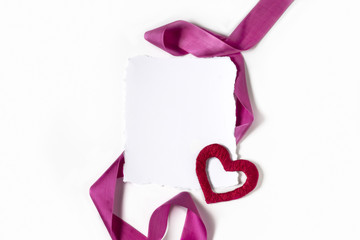 Wall Mural - Blank sheet of paper. Heart and pink ribbon on a white background