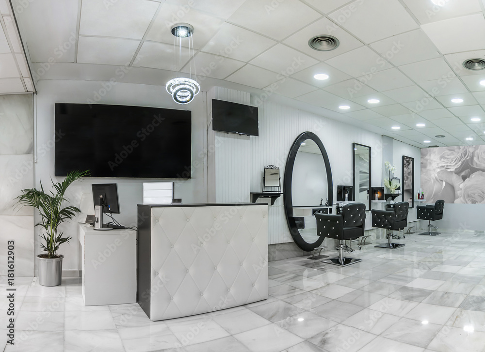 Reception in a beauty salon with desk,plant and banners. Hair salon interior. - obrazy, fototapety, plakaty 