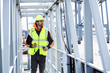 © sanneberg - Guy working the docks in reflective work wear
