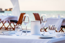 Beautiful Table Set Up For A Dinner On The Beach