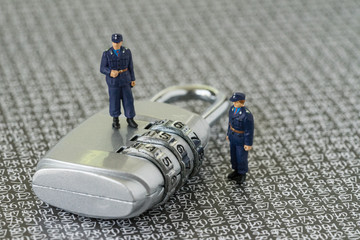 Aufkleber - computer security or hacker protection concept, with miniature figure security guard standing on com