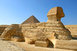 Great Sphinx of Giza profile with pyramid of Khafre in the background - Cairo, Egypt