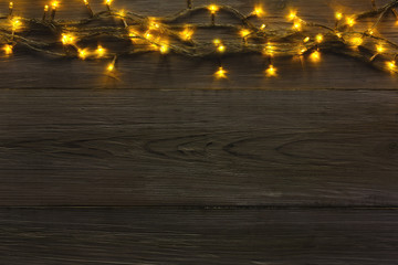 Canvas Print - Christmas lights border on grey wooden background