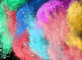 Fototapeta Tęcza - Freeze motion of colored powder explosions isolated on white background