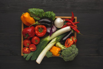 Wall Mural - Border of fresh vegetables on wooden background with copy space