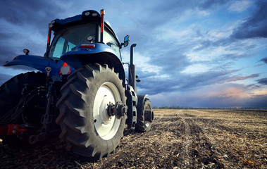 Poster - A powerful tractor handles the ground