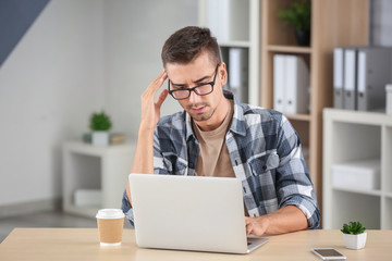 Poster - Attractive man with laptop at home