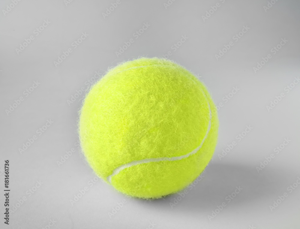 Tennis ball on grey background