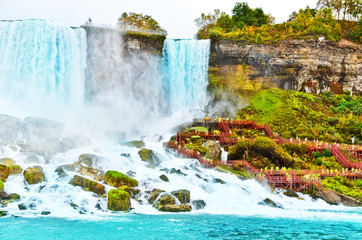 Wall Mural - view from the bottom of niagara falls at american side with water splashing in the air