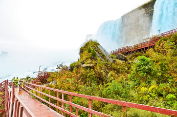 Wall Mural - view from the bottom of niagara falls at american side with water splashing in the air
